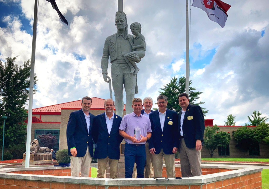 KDKA Sports Anchor Rich Walsh is flanked by Pittsburgh Syria Shrine members (left to right) Todd Green, Al Tedeschi, Randy Hobaugh, Illustrious Potentate Don Green and Scott Green.